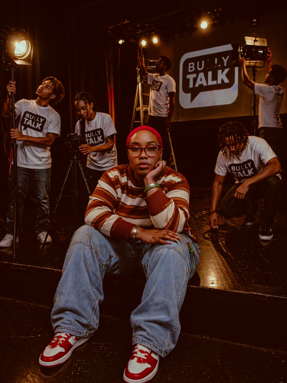 Kina Evans speaking on stage at an event