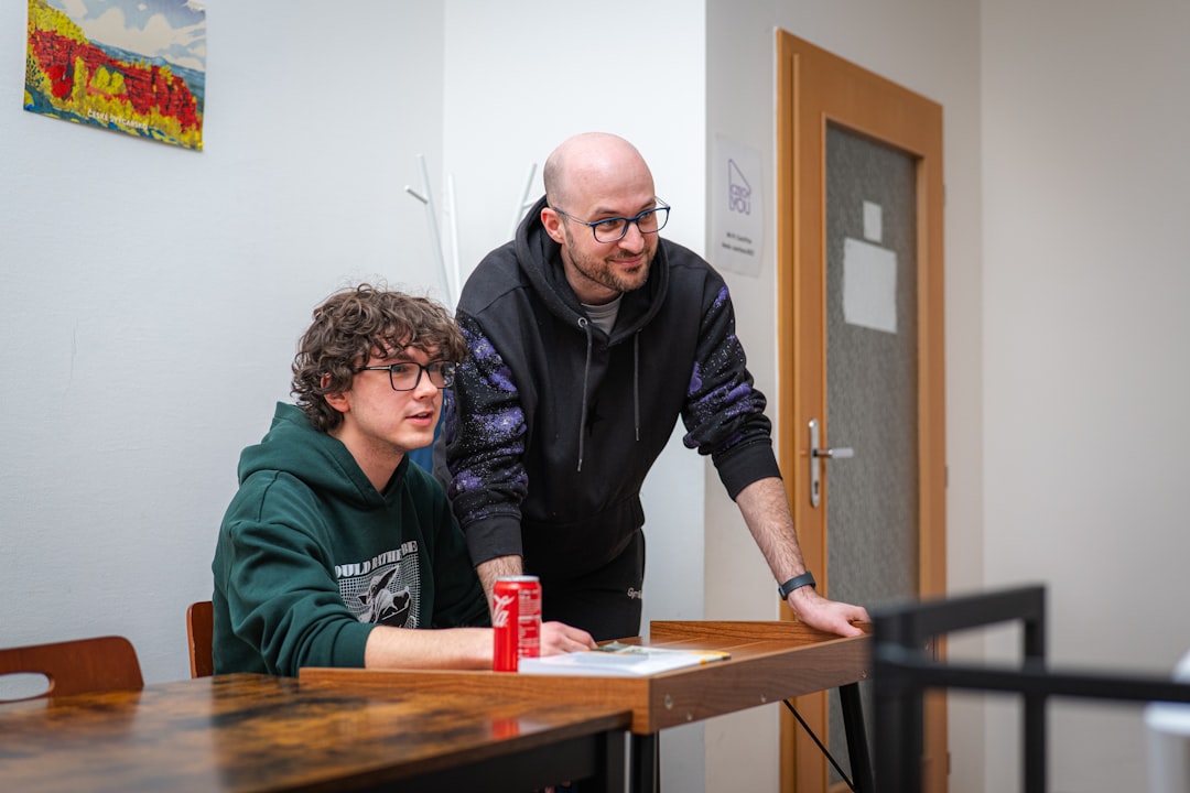 Older teenagers mentoring and helping younger students